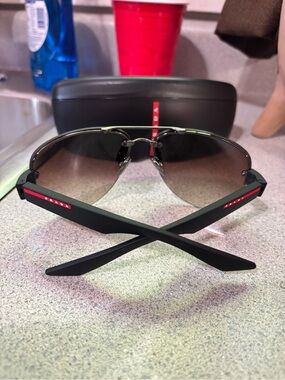 Prada Black Sunglasses with Brown Gradient Lenses and Red Accents